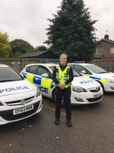 Billie Scholten with police cars in Biggleswade